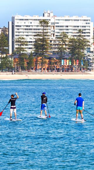 Stand up paddleboardingin Manly, Sydney North